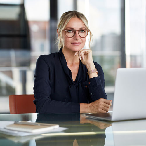 businesswoman-working-in-office-using-laptop-2024-09-18-20-39-29-utc